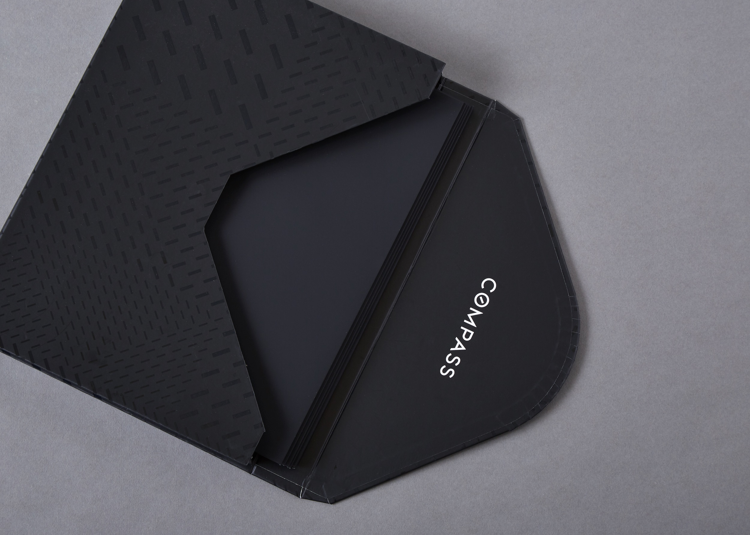 /media/082818_Compass_binder.jpg